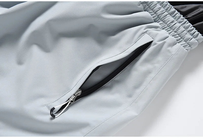 Remi – Unisex Snowboard-Einteiler – Grau